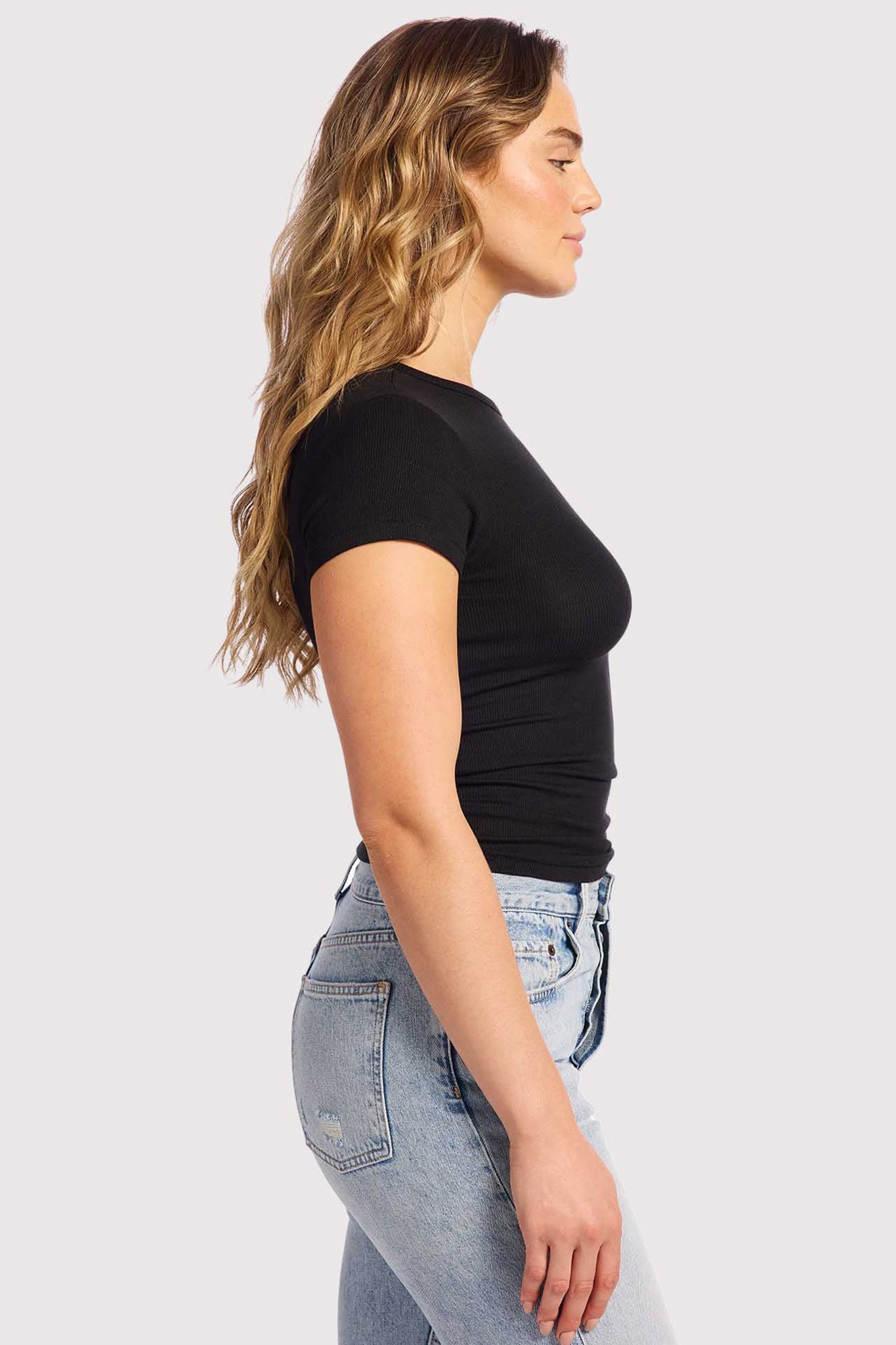 A single green leaf against a white background.